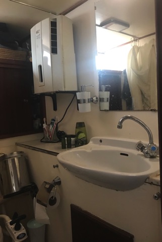 Washroom in master cabin. Three piece. That is a dehumidifier on the wall.