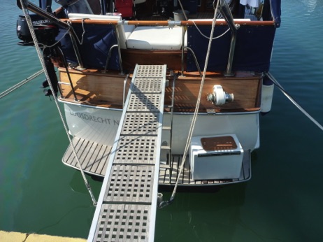 Teak passarelle on chrome davits. Mounts for low and high docks.